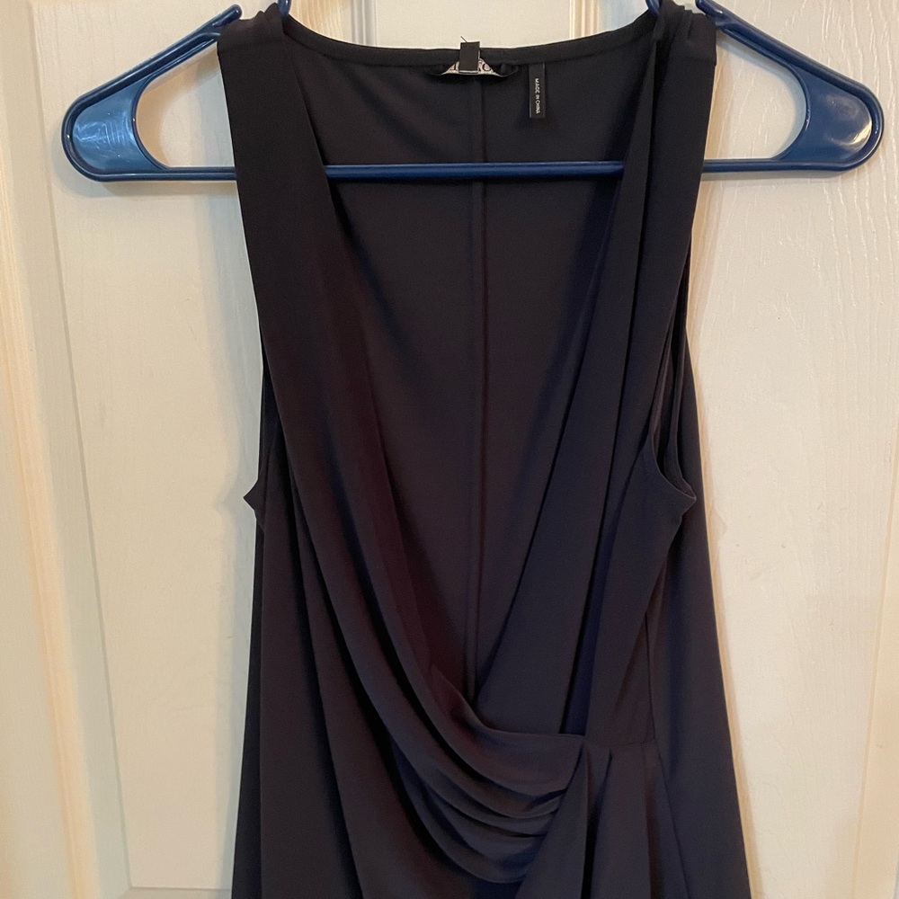 Dressy elegant black sleeveless knit top. Side gathering for cinching waist.